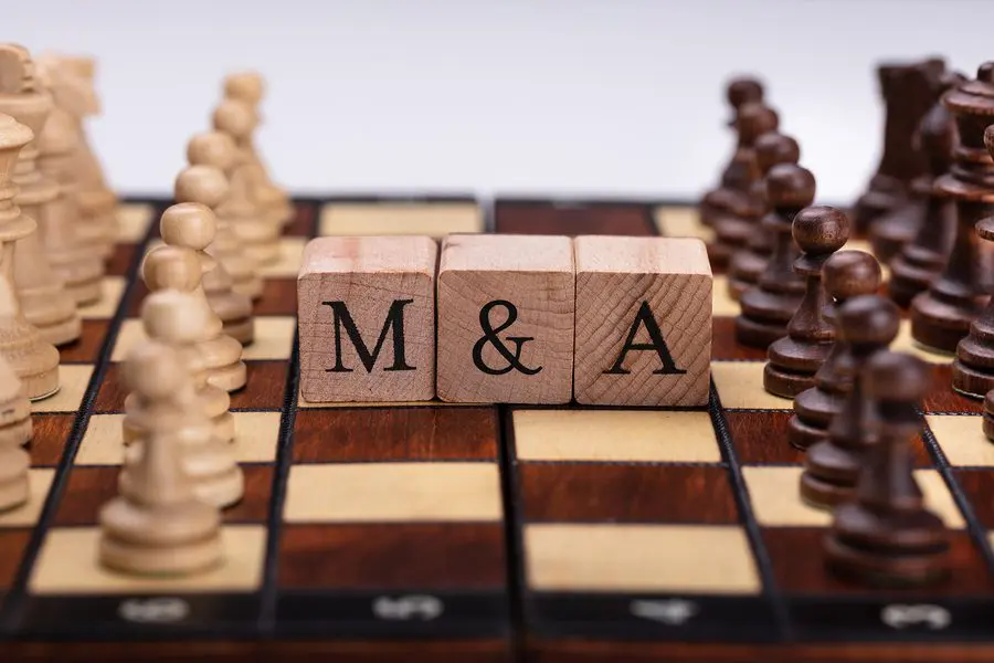 Chessboard With Wooden Blocks Showing Mergers And Acquisitions Concept