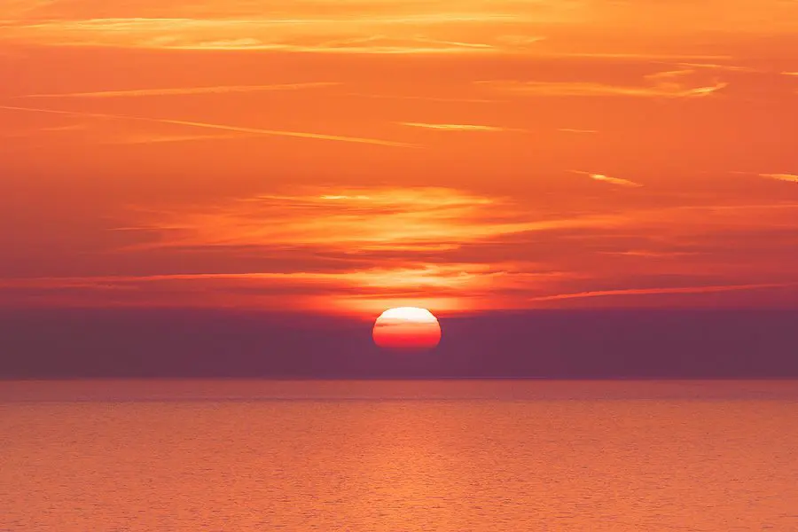 Sunset over the sea horizon nature landscape. Red clouds and sea landscape. Sea nature in sunset. Nature landscape. Sunset landscape background. Sunset over the sea landscape. Red sunset background. Landscape. Nature.