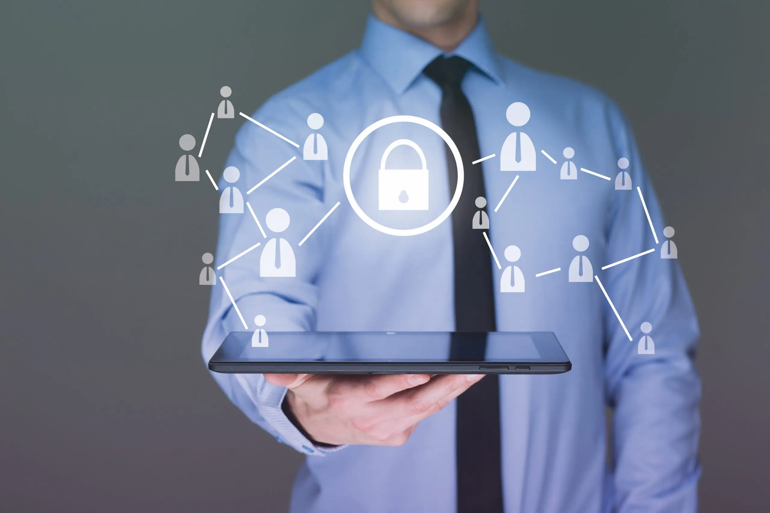Businessman holds Ipad Cybersecurity