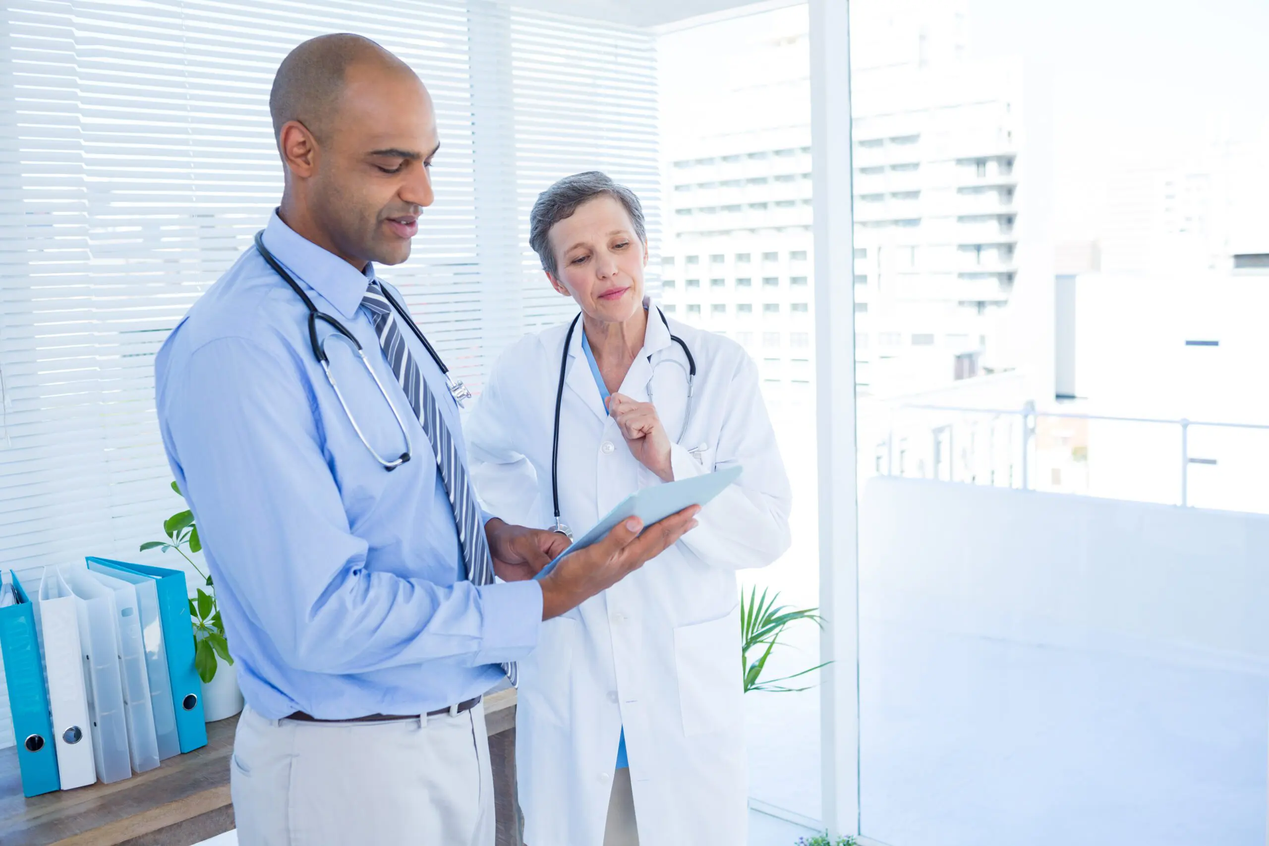 Medical Workers Looking at Tablet