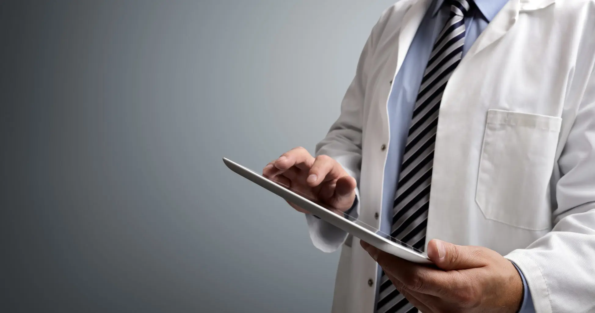 Doctor using tablet for EMR