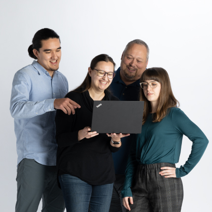 Group looking at computer