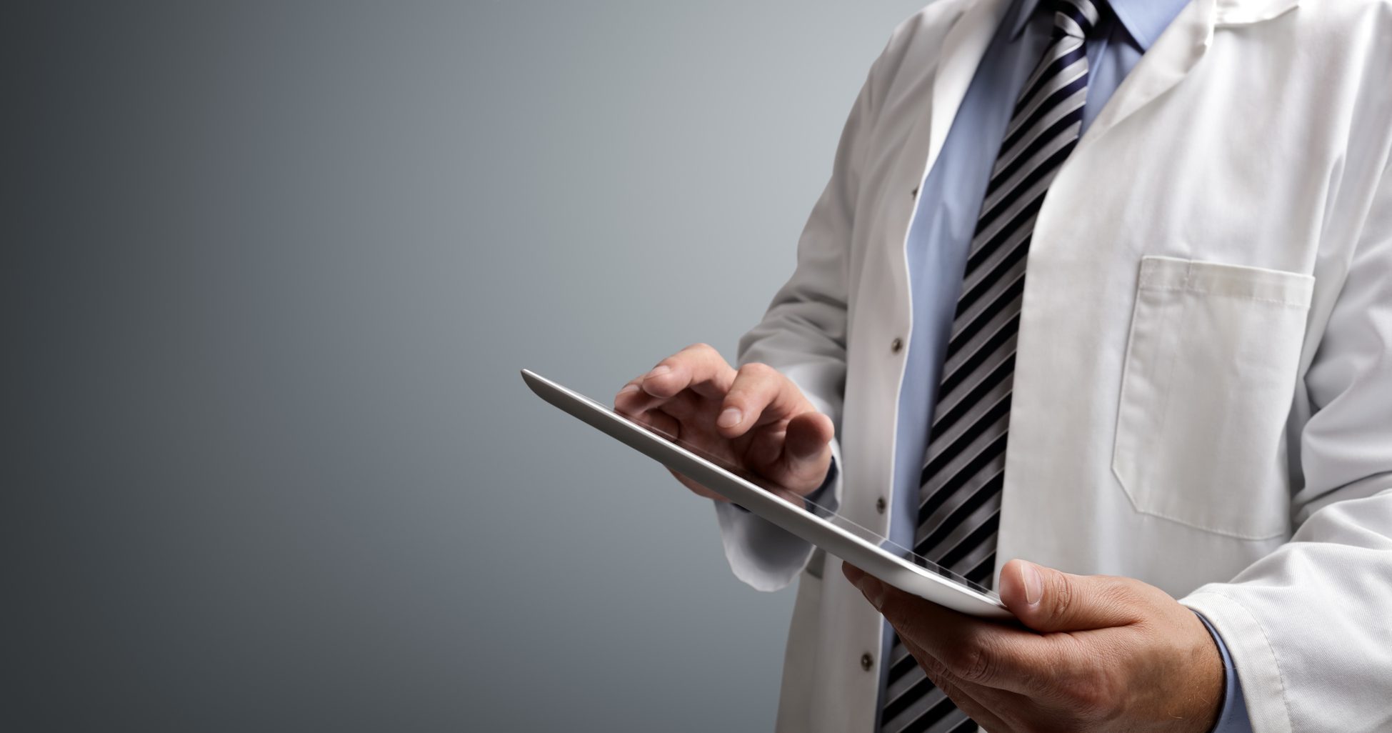 Doctor using tablet for EMR