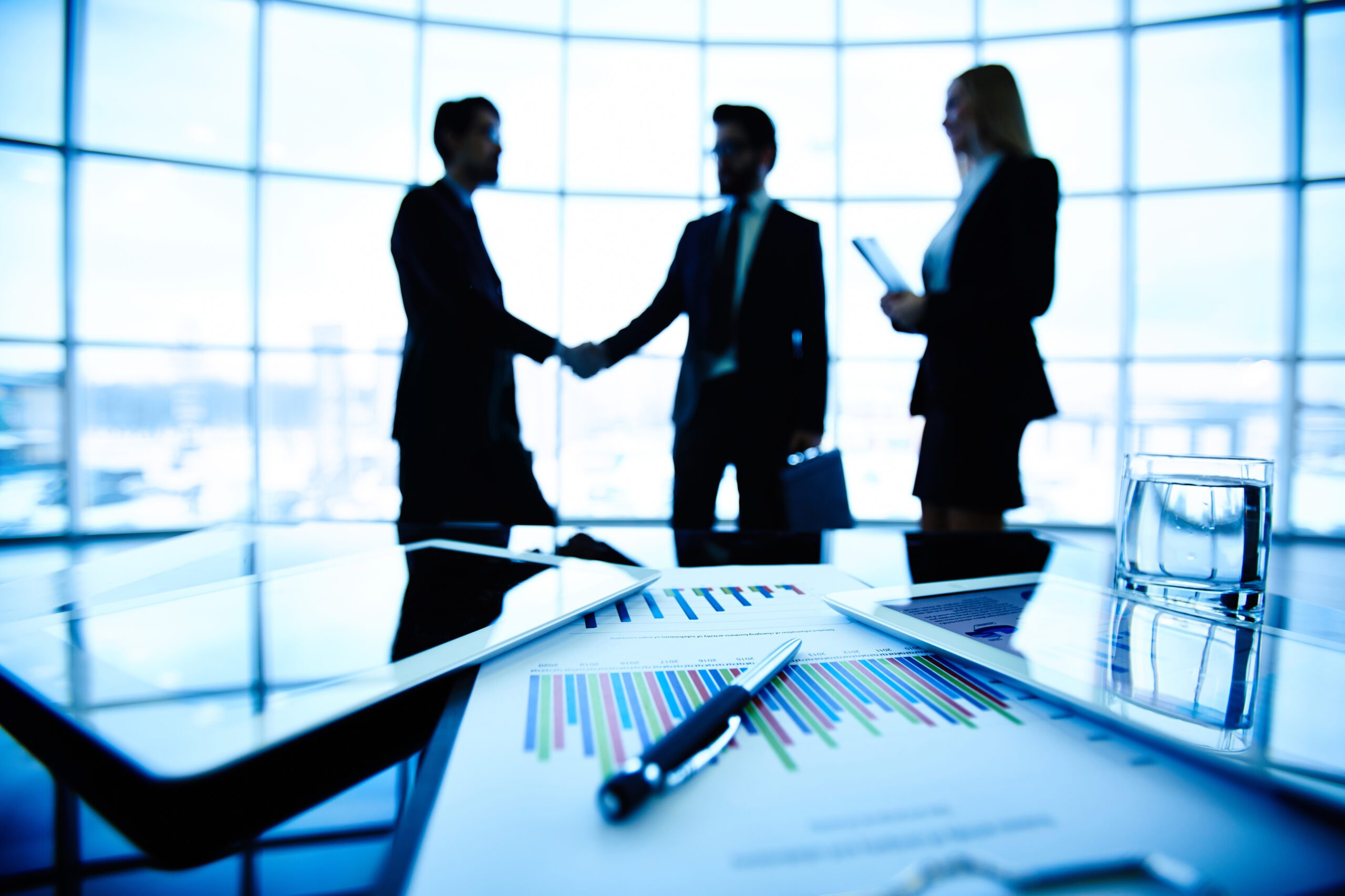 Making a business deal in a room with three people